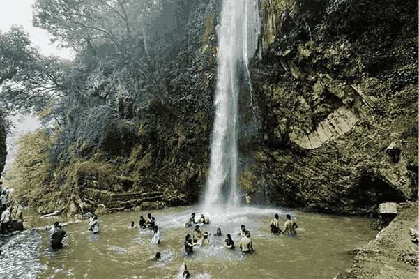 Tiger Falls Chakrata waterfall surrounded by dense forest Uttarakhand