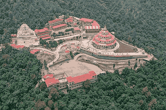 Dol Ashram in Almora with colorful temple architecture and scenic mountain surroundings.